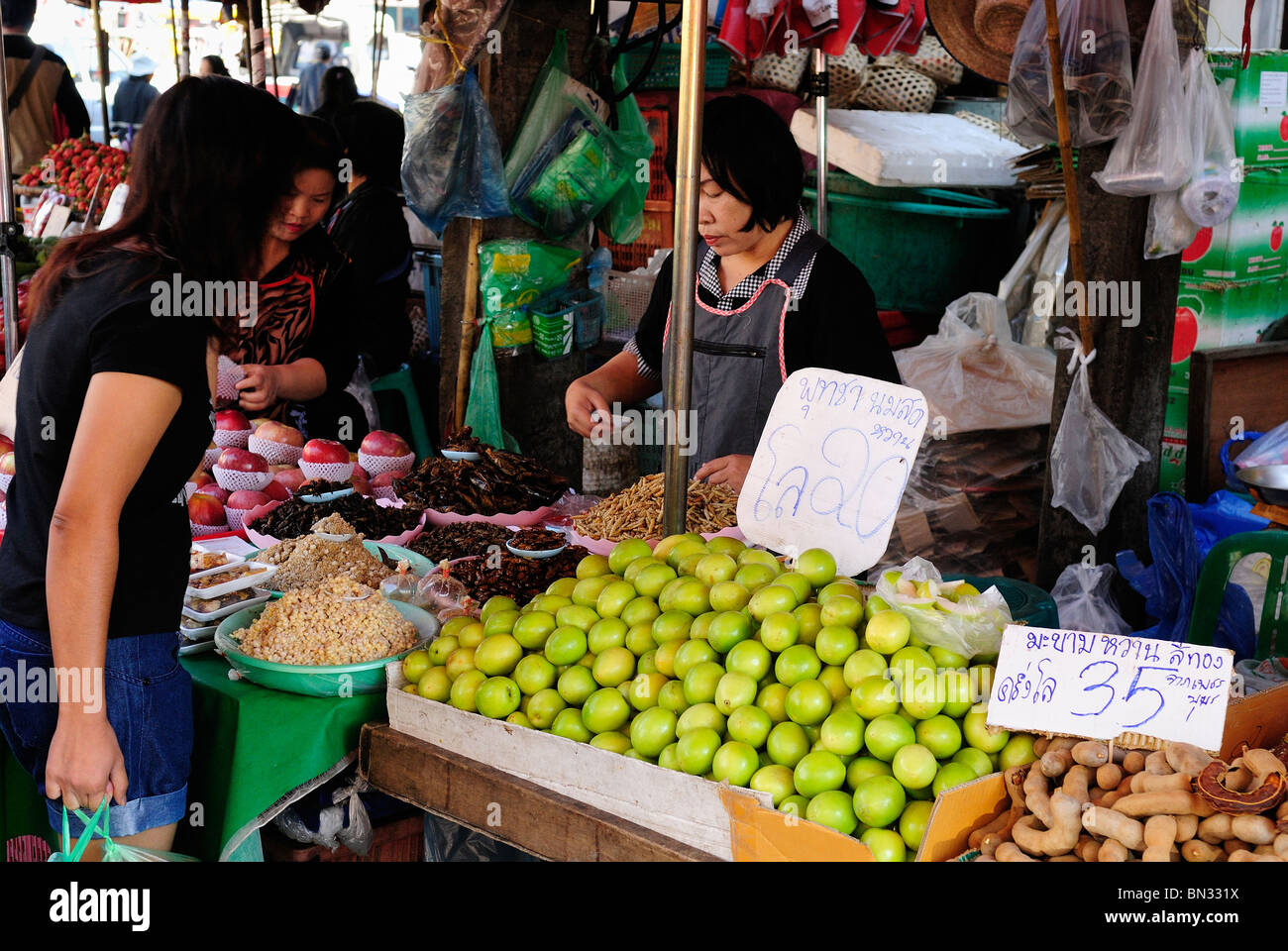 Thai woman selling fruits and vegetables in a street in Chiang Mai ...