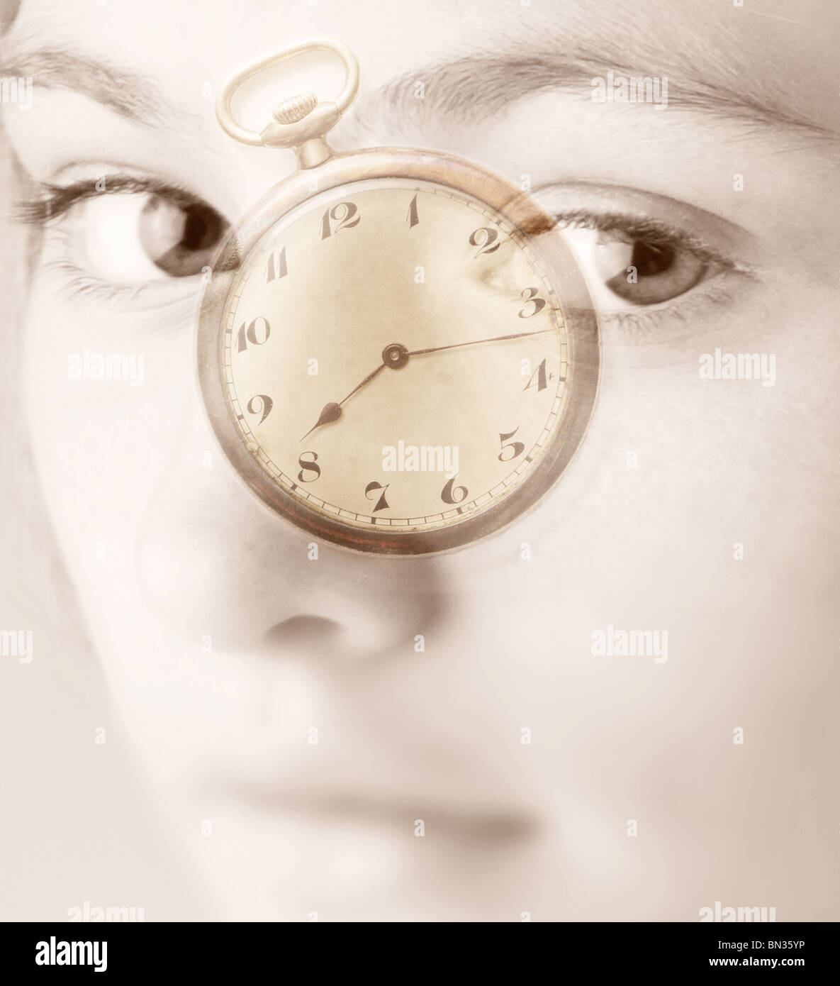 A pocket watch superimposed over a photograph of a girl Stock Photo