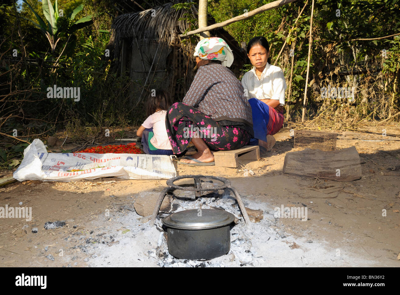 Portrait of women sitting and talking in a Red Karen village, hill tribe near Mae Hong Son, Northern Thailand, Asia Stock Photo