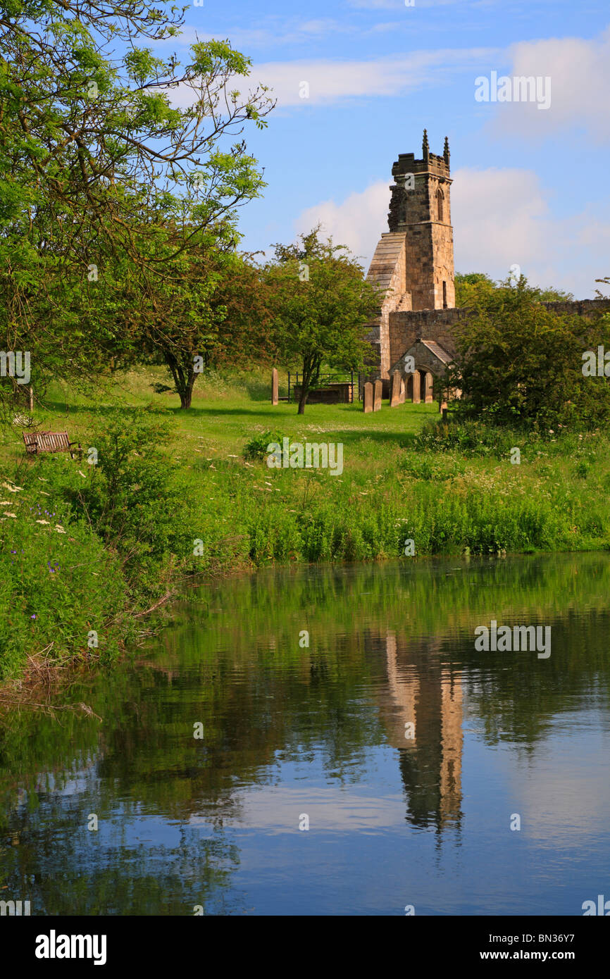 The fishpond and ruins of St Martin's Church at Wharram Percy, deserted medieval village on the Yorkshire Wolds Way, North Yorkshire, England, UK. Stock Photo