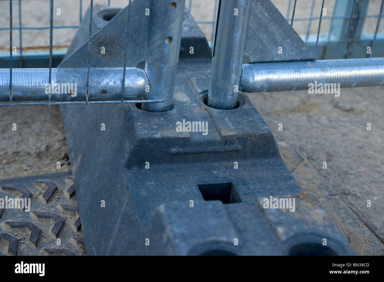 harris security fencing sited into its rubber floor block Stock Photo
