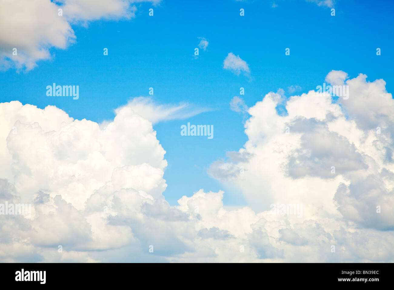 blue sky with white fluffy clouds background Stock Photo - Alamy