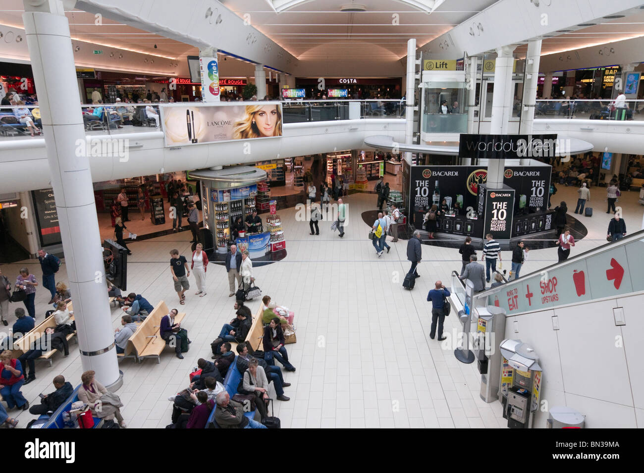 Gatwick South Terminal departure concourse with retail and dining Stock