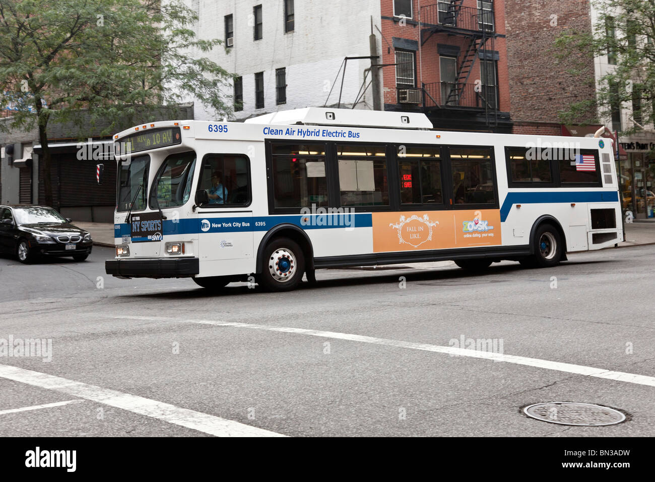 NY Transit Authority hybrid electric bus moves through
