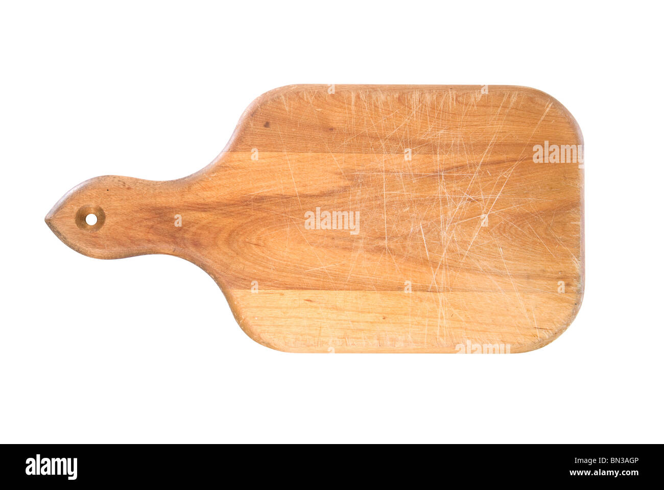 A used cutting board with chop marks isolated on white. Stock Photo