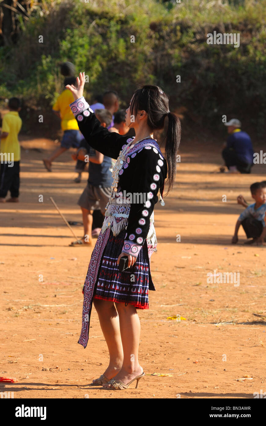 Hmong teenager playing the game of love in Ban Pha-nok-kok village, near Chiang Mai, Thailand, Asia Stock Photo