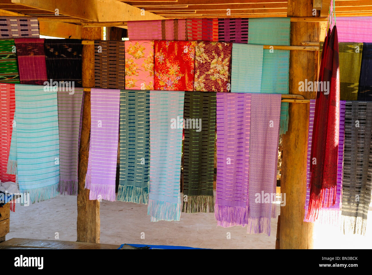Display of woven stoles in a Kayan (ethnic minority) village, Mae Hong Son, Northern Thailand, Asia Stock Photo