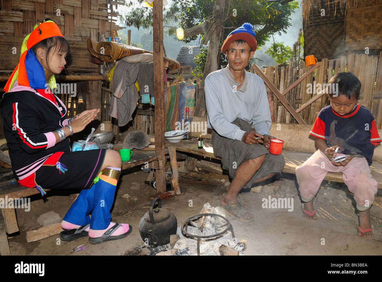 Kayan (ethnic minority) people also called longneck drinking coffee, Mae Hong Son, Northern Thailand, Asia Stock Photo