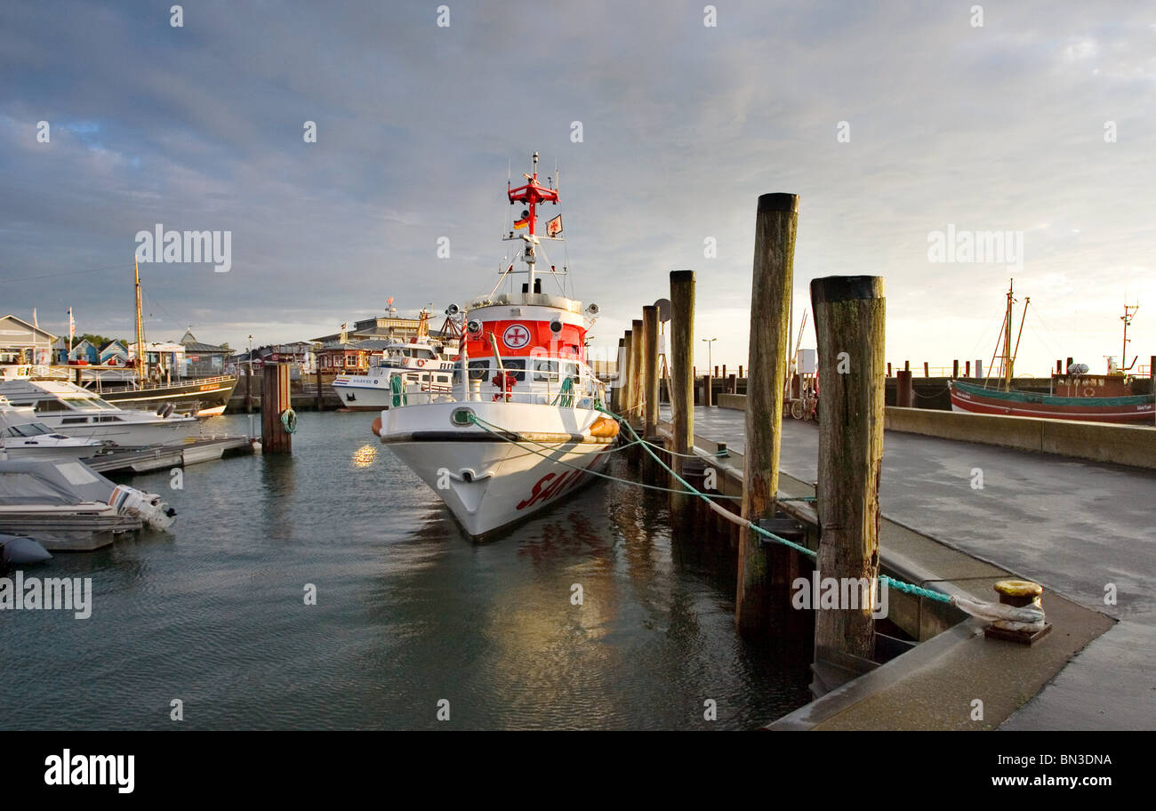 A search and rescue vessel and yachts at the harbour of List, Sylt, Germany Stock Photo