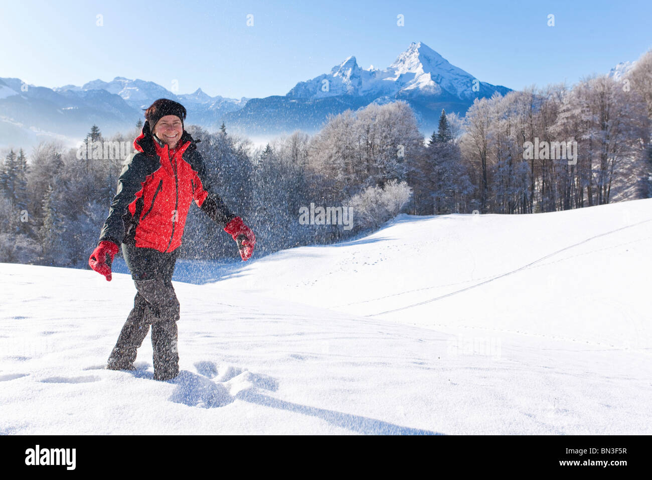 Woman walking snow facing hi-res stock photography and images - Alamy