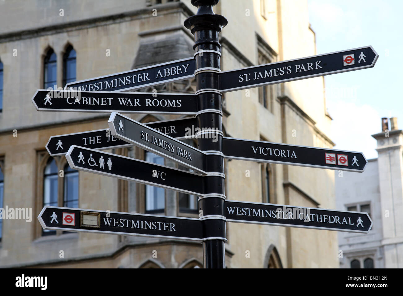 London tourist attraction signpost with direction signs in London, England Stock Photo