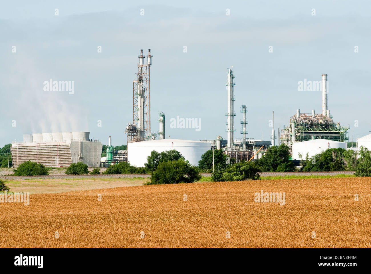 A Nitrogenous Fertilizer Plant in Oklahoma with a ripe wheat field in the foreground. Stock Photo