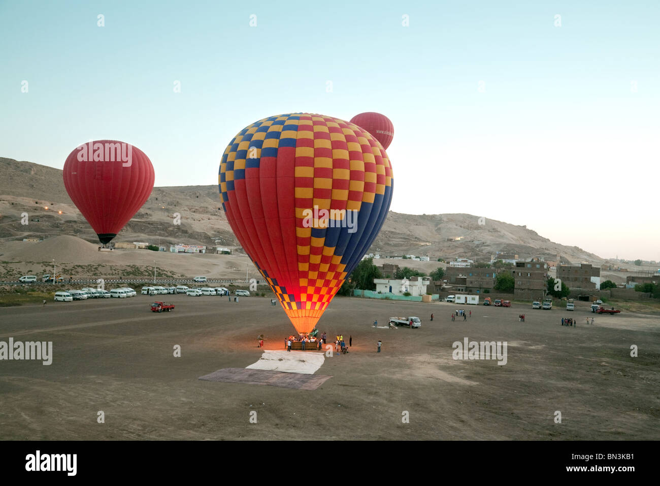 Hot air balloons lifting off at dawn, Luxor, Egypt, Africa Stock Photo