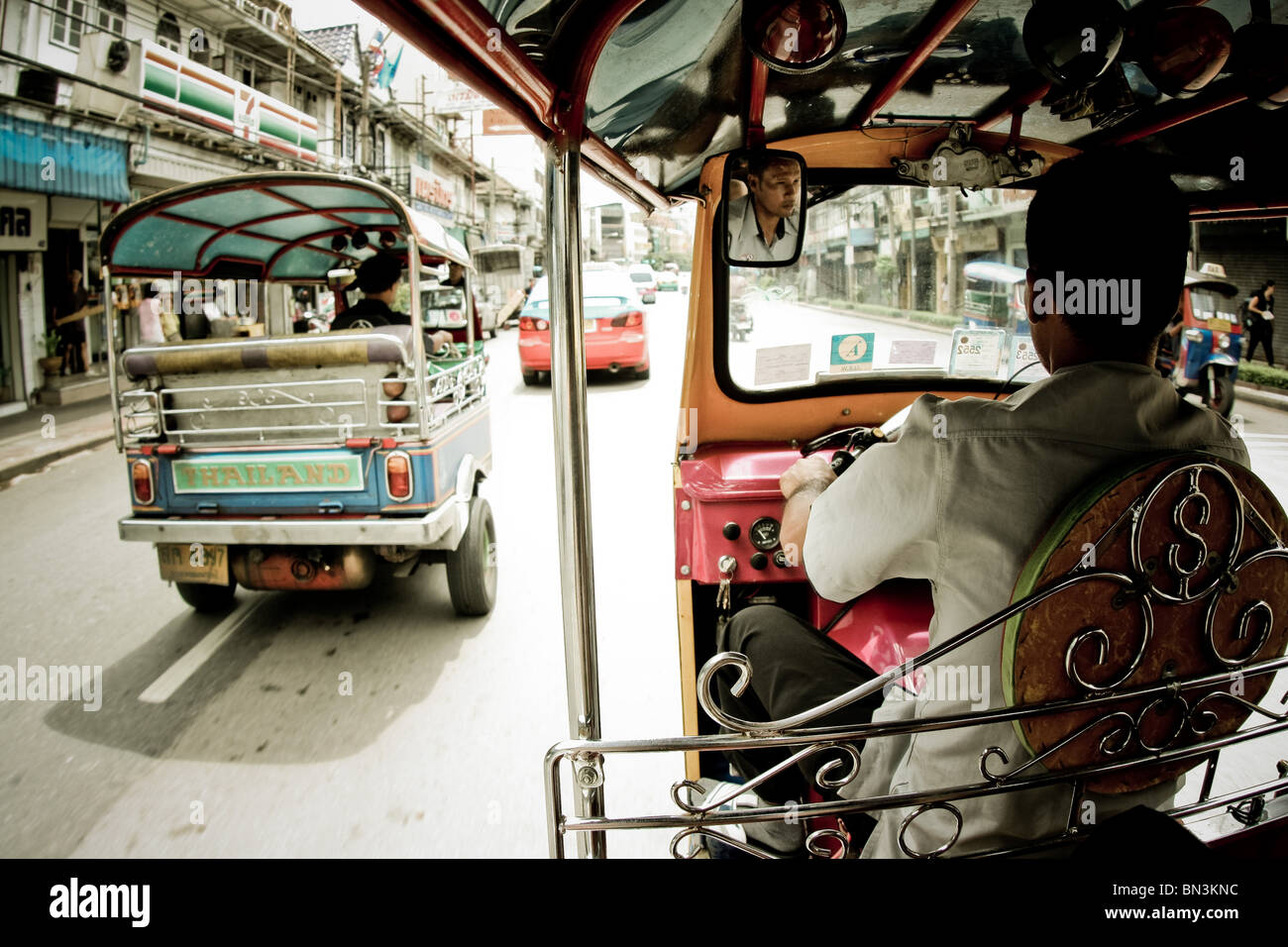 Tuk-tuks on a street in Bangkok, Thailand Stock Photo