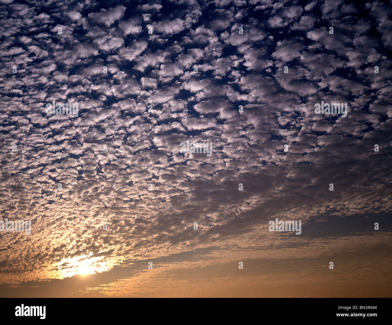 Sunlight radiating through clouds Stock Photo