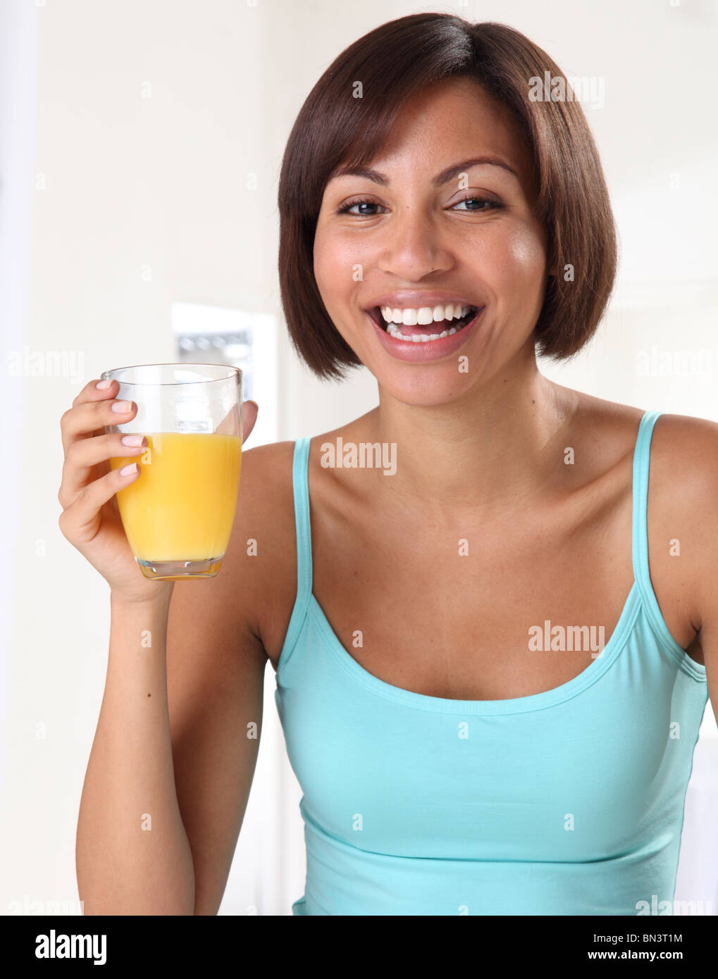 WOMAN WITH GLASS OF ORANGE JUICE Stock Photo Alamy