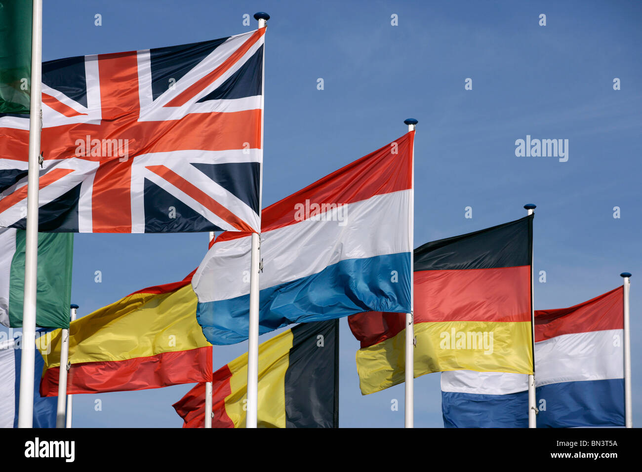 National flags fluttering against sky Stock Photo