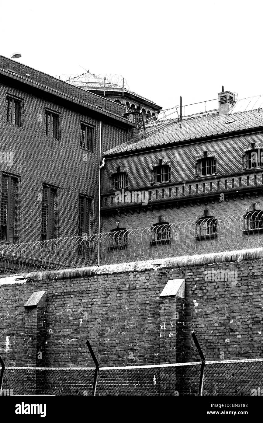 Chainlink fence in front of building Stock Photo