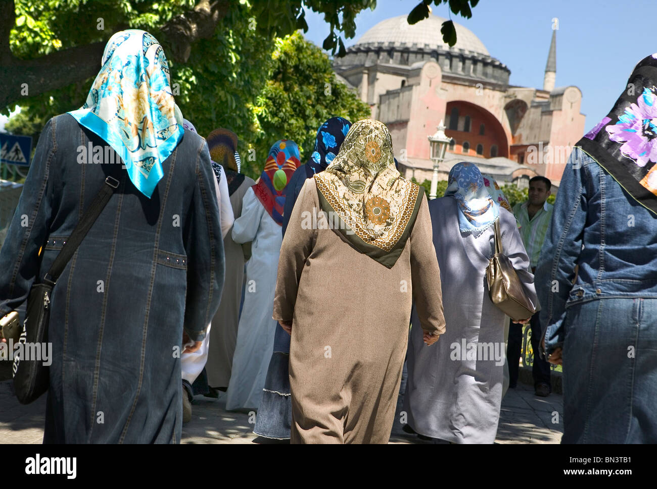 Rear view of women walking in street Stock Photo - Alamy