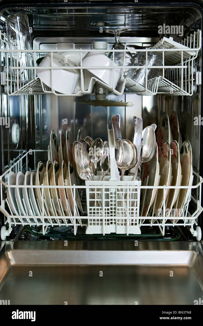 Kitchen utensils in dishwasher Stock Photo Alamy