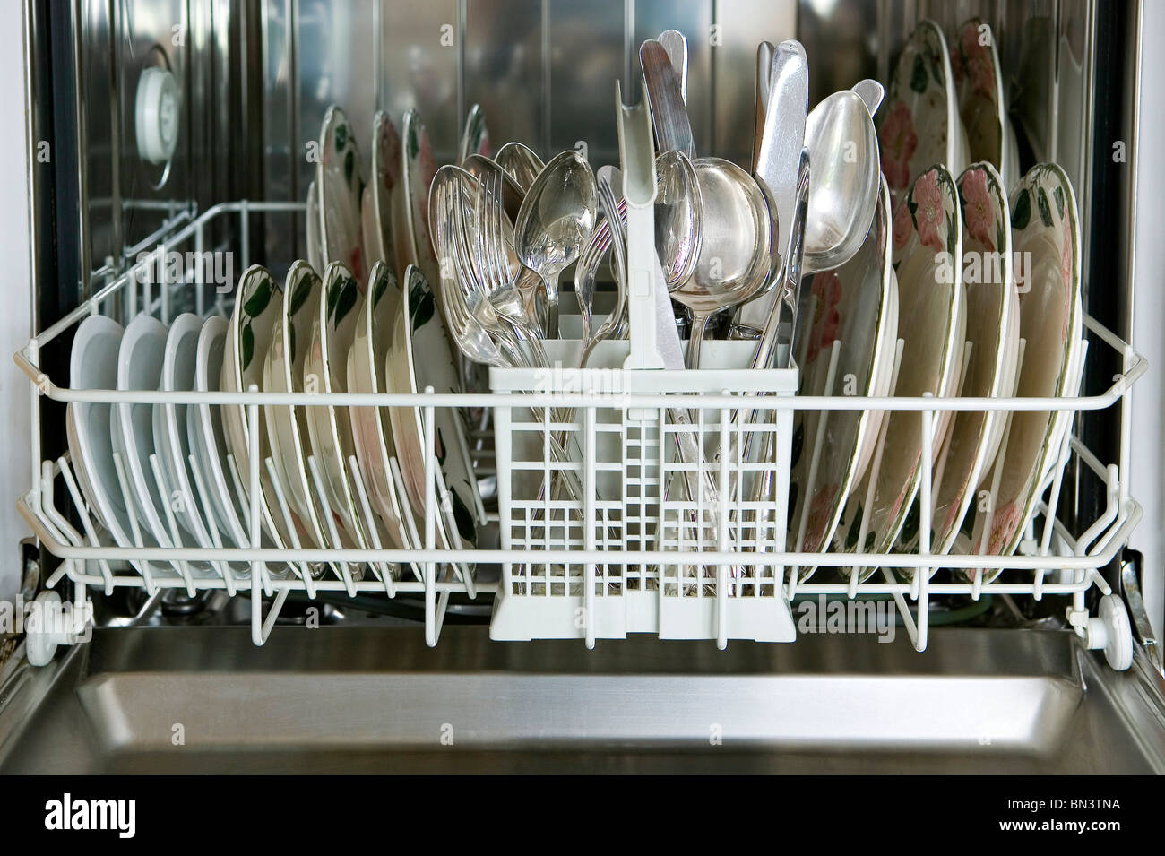 Kitchen utensils in dishwasher Stock Photo Alamy