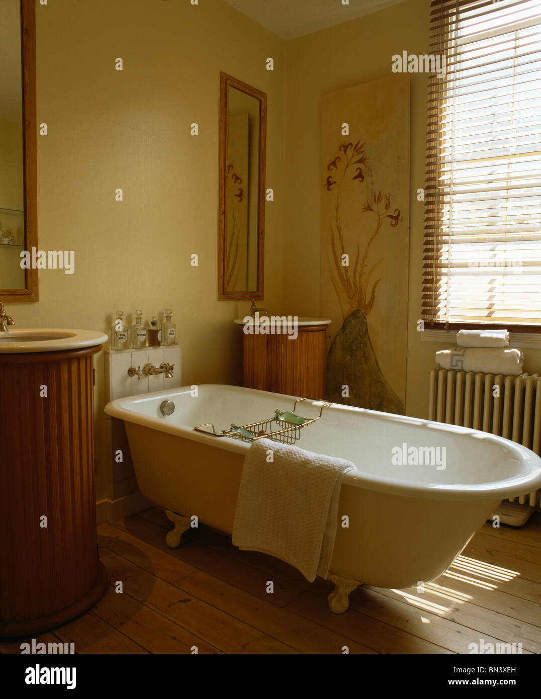 Roll Top Bath In Cream Bathroom With Double Basins In Paneled Stock Photo Alamy