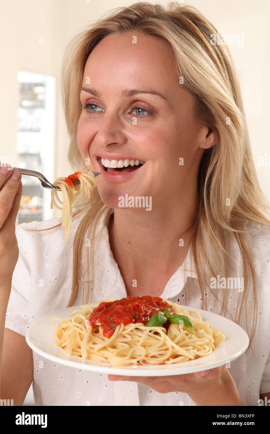 WOMAN EATING PASTA Stock Photo Alamy