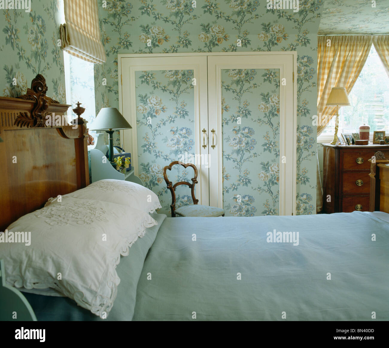 Blue Bed Cover And White Pillows On Bed In Country Bedroom With