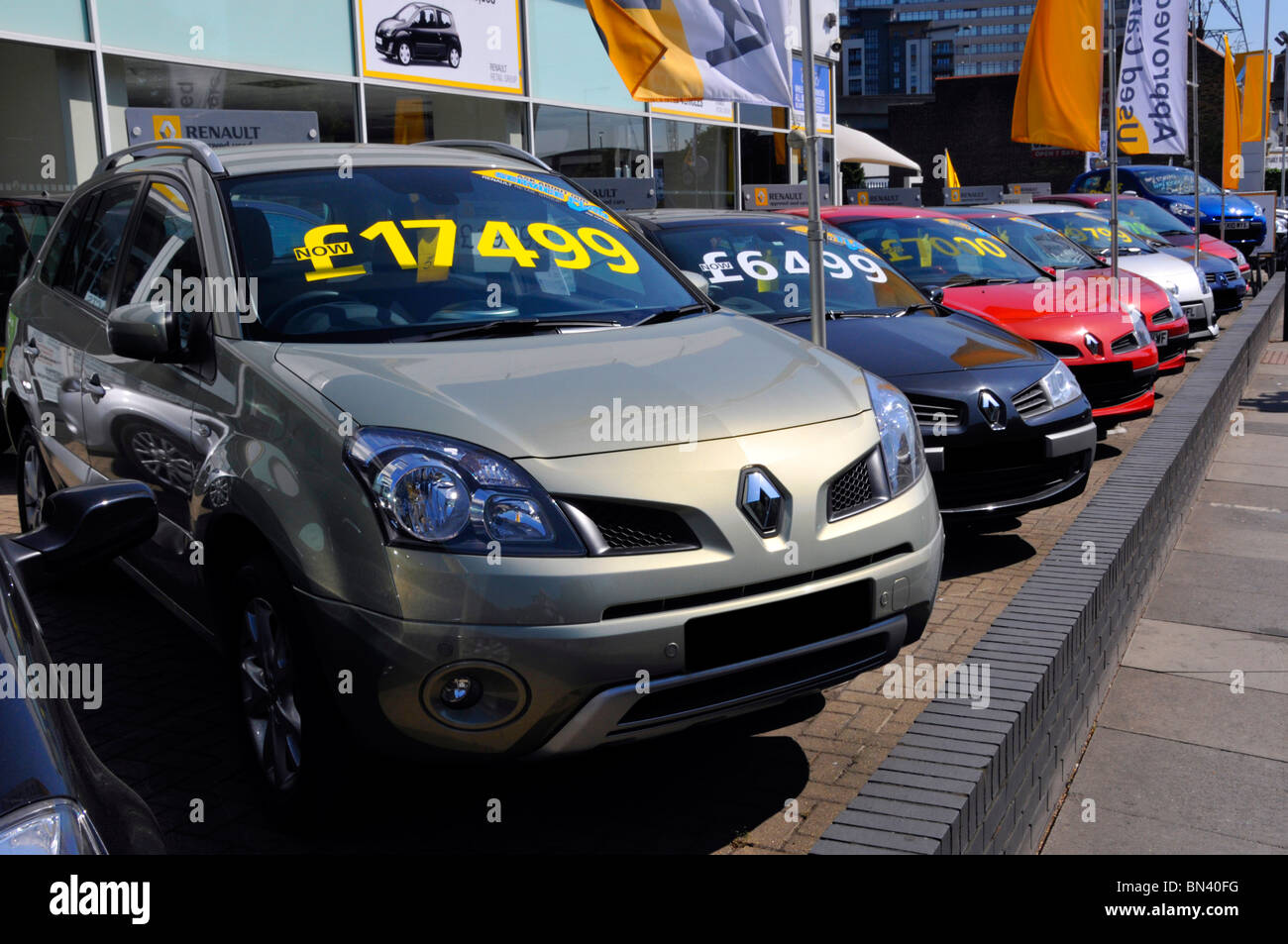 Row of second hand used cars outside Renault car dealer on a pavement