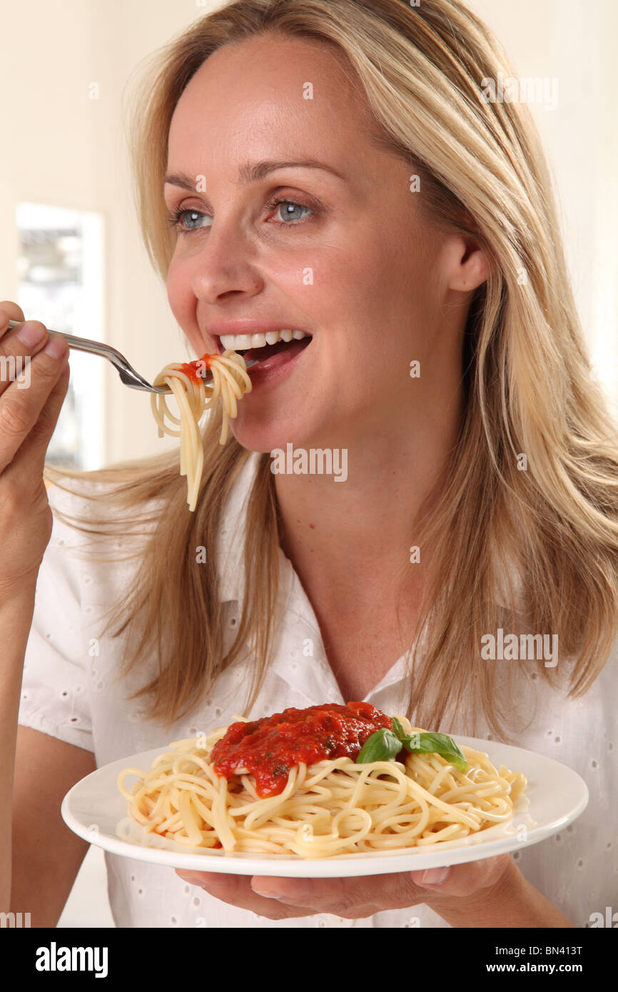WOMAN EATING PASTA Stock Photo Alamy