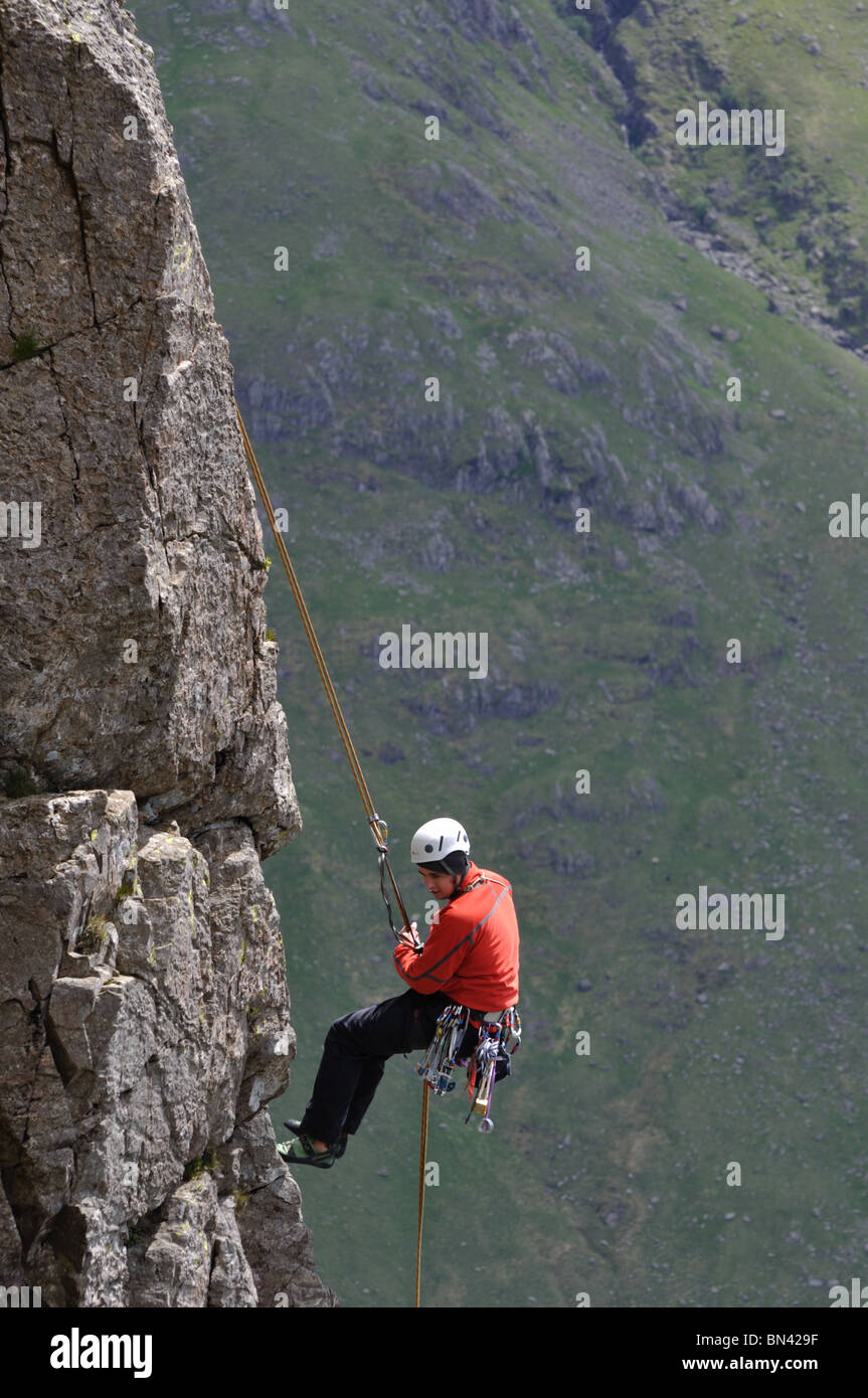 A climber abseils ( rappels) off Napes Needle on Great Gable in the