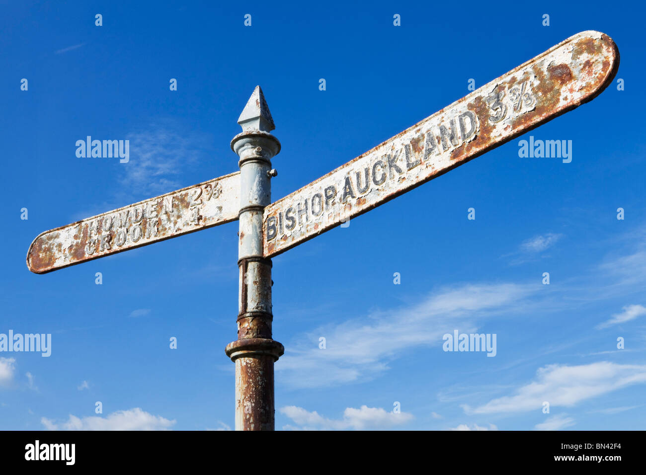 Signpost pointing east to Bishop Auckland and west to Howden and Crook near the village of Witton Park, Weardale, County Durham Stock Photo