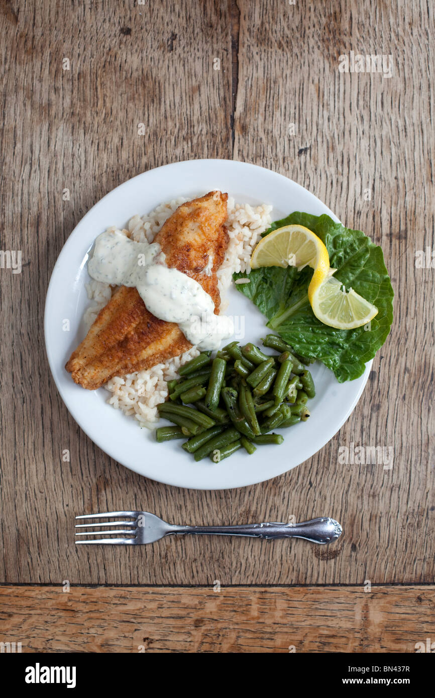 A French-style breading on local catfish served with green beans. Shot at The Crown Restaurant, Indianola, Mississippi. Stock Photo