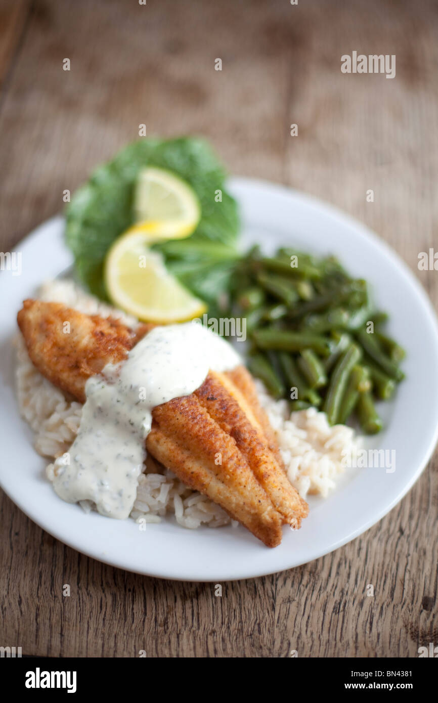 A French-style breading on local catfish served with green beans. Shot at The Crown Restaurant, Indianola, Mississippi. Stock Photo