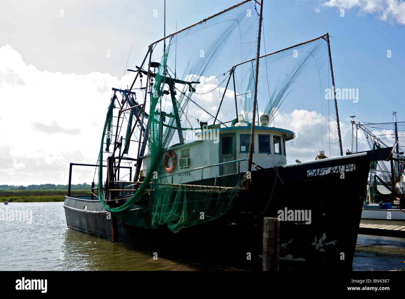 Shrimp trawler boat tied to dock at Hackberry Seafood docks Cameron