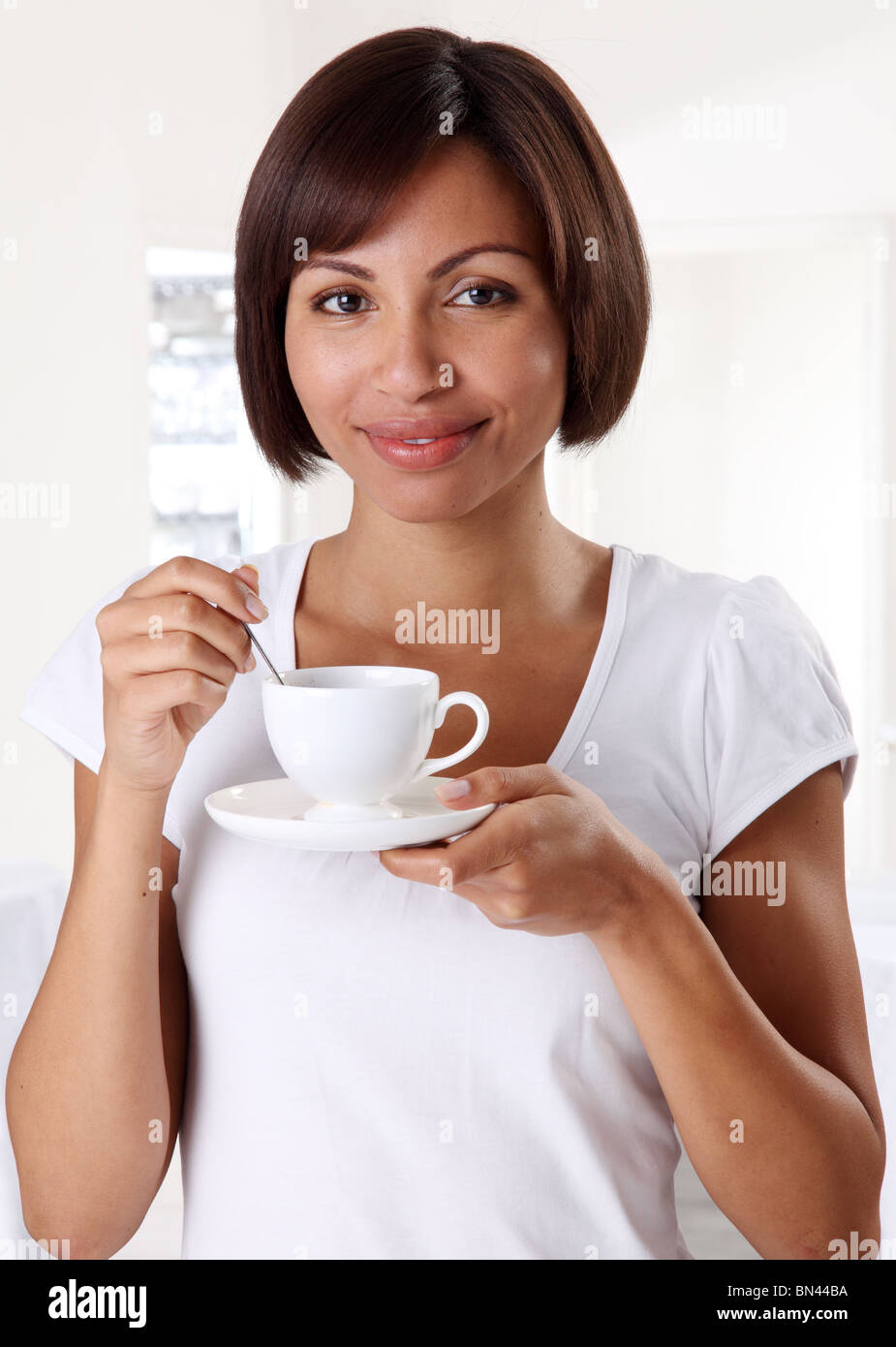 WOMAN HOLDING TEA CUP Stock Photo