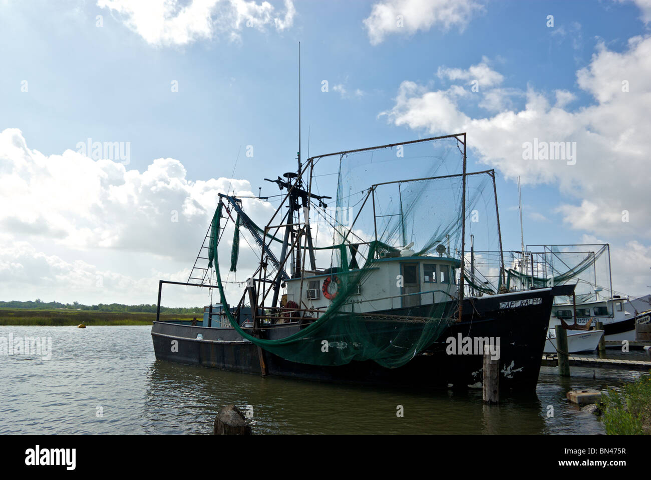 Shrimp trawler boats tied to dock at Hackberry Seafood docks Cameron