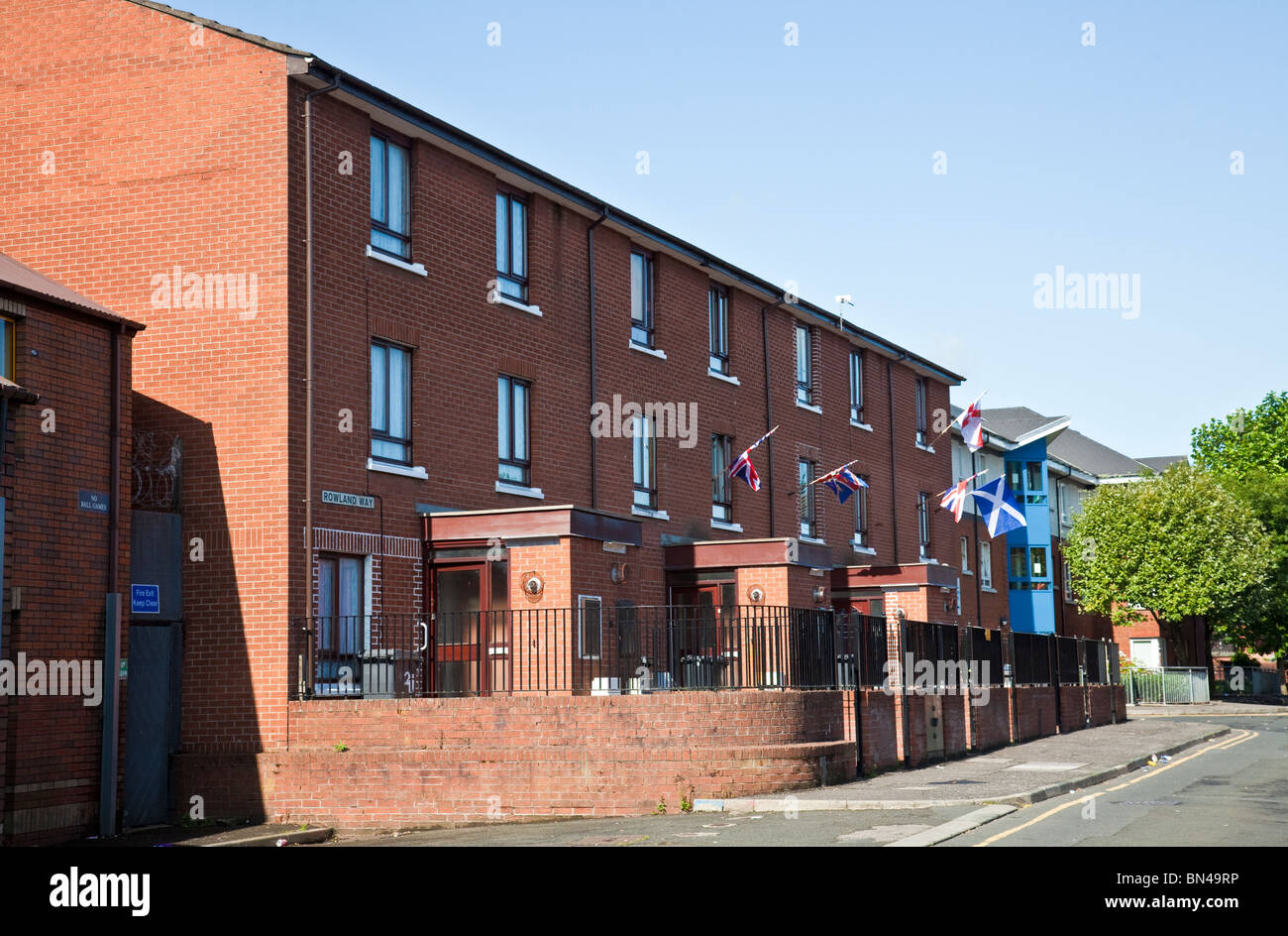Rowland Way, part of the traditionally staunchly Protestant/Loyallist Sandy Row area of South Belfast. Union Flags and a Saltire Stock Photo