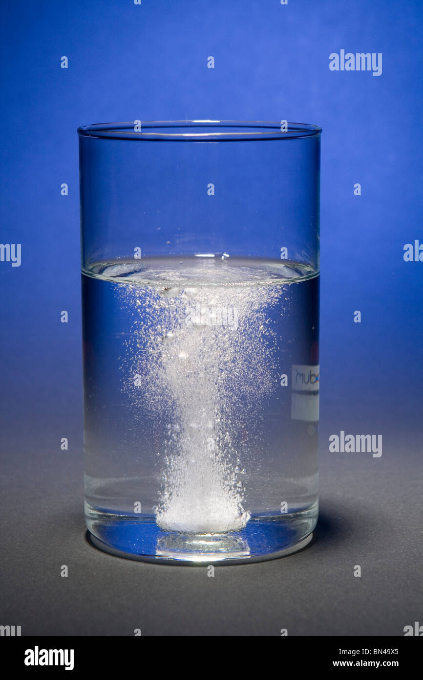Effervescent tablet dissolving in water hires stock photography and