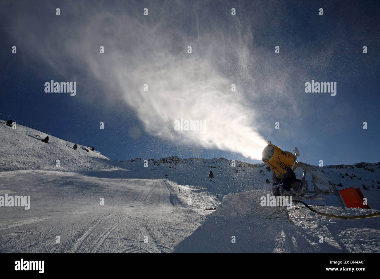 A snow cannon in back light, Jerzens, Austria Stock Photo