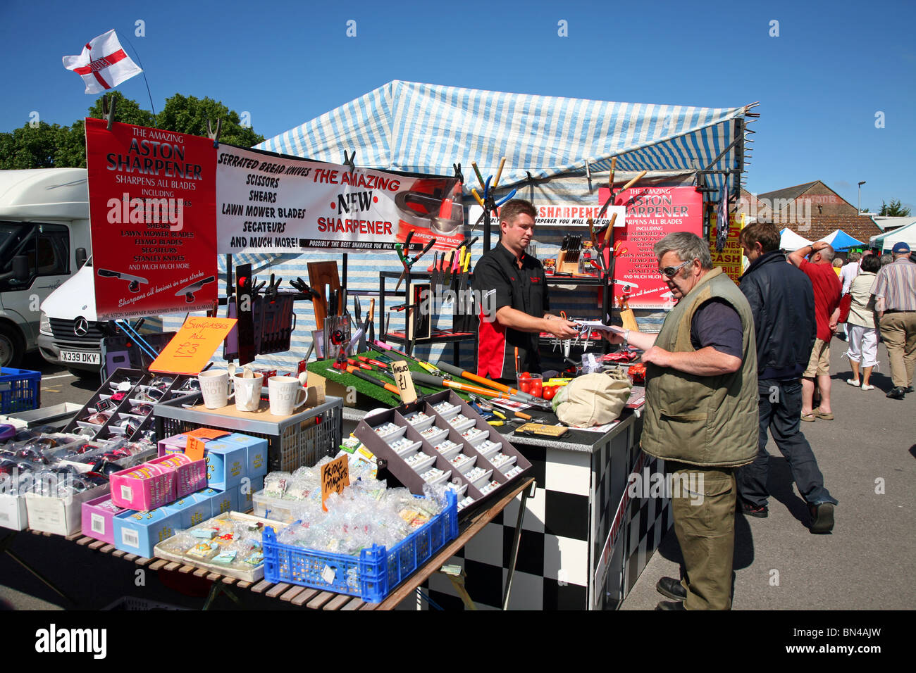 Shoppers perusing a stall at Dorchester Market Stock Photo Alamy