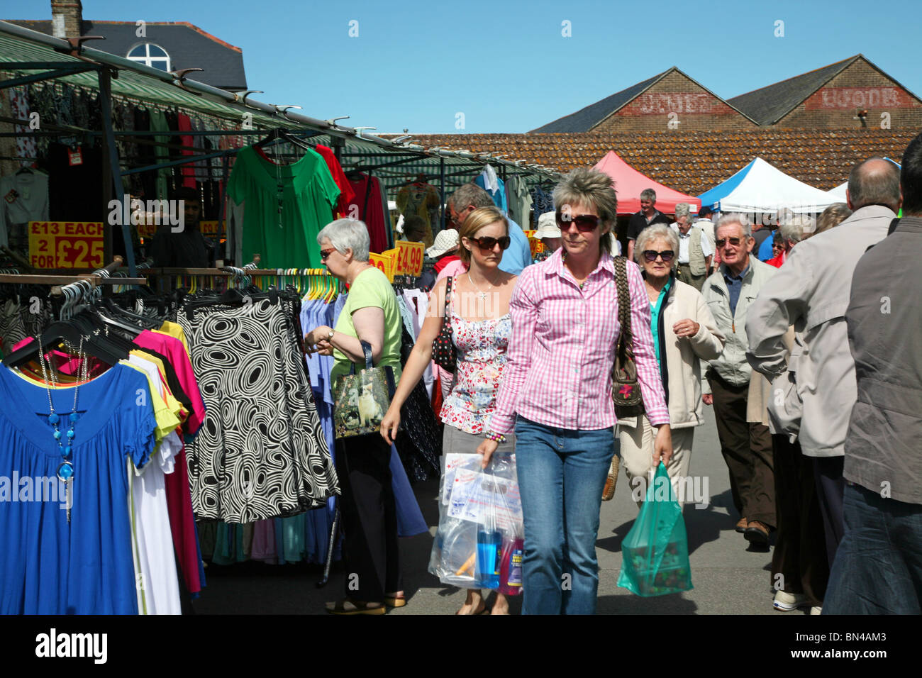 Good choice of clothes stalls at Dorchester Market Stock Photo Alamy