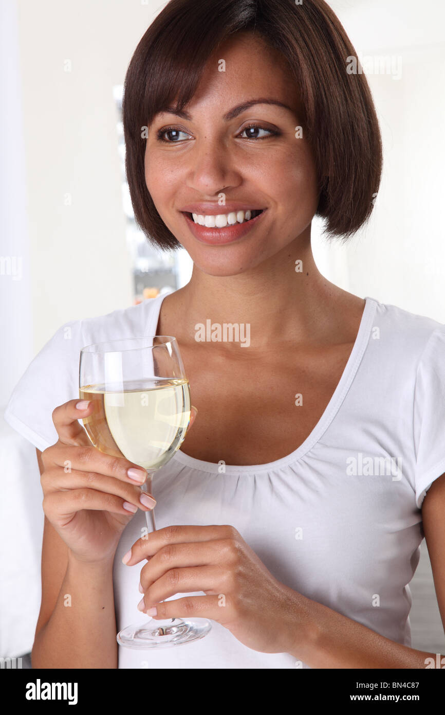 WOMAN HOLDING A GLASS OF WHITE WINE Stock Photo Alamy