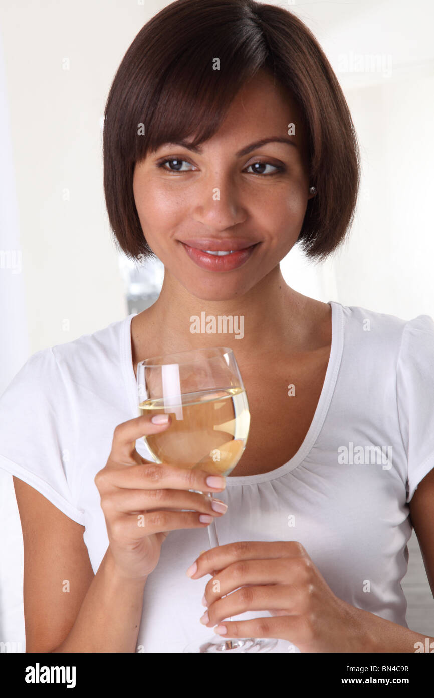 WOMAN HOLDING A GLASS OF WHITE WINE Stock Photo Alamy