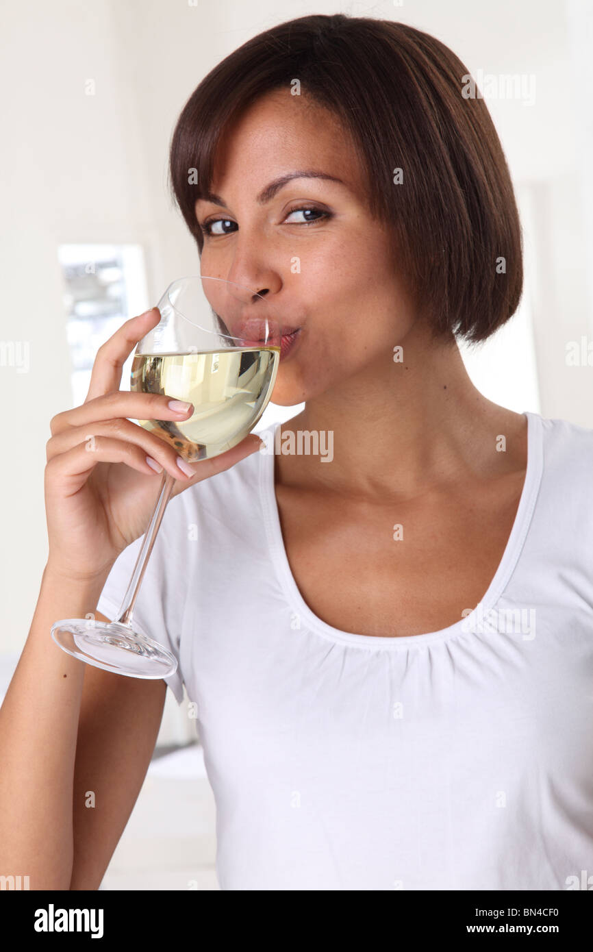 WOMAN DRINKING A GLASS OF WHITE WINE Stock Photo Alamy