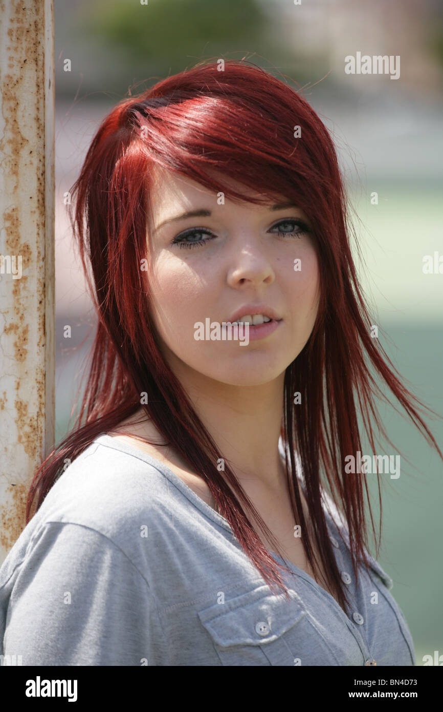 Close Up Of A Pretty Teenage Girl With Dyed Red Hair Stock