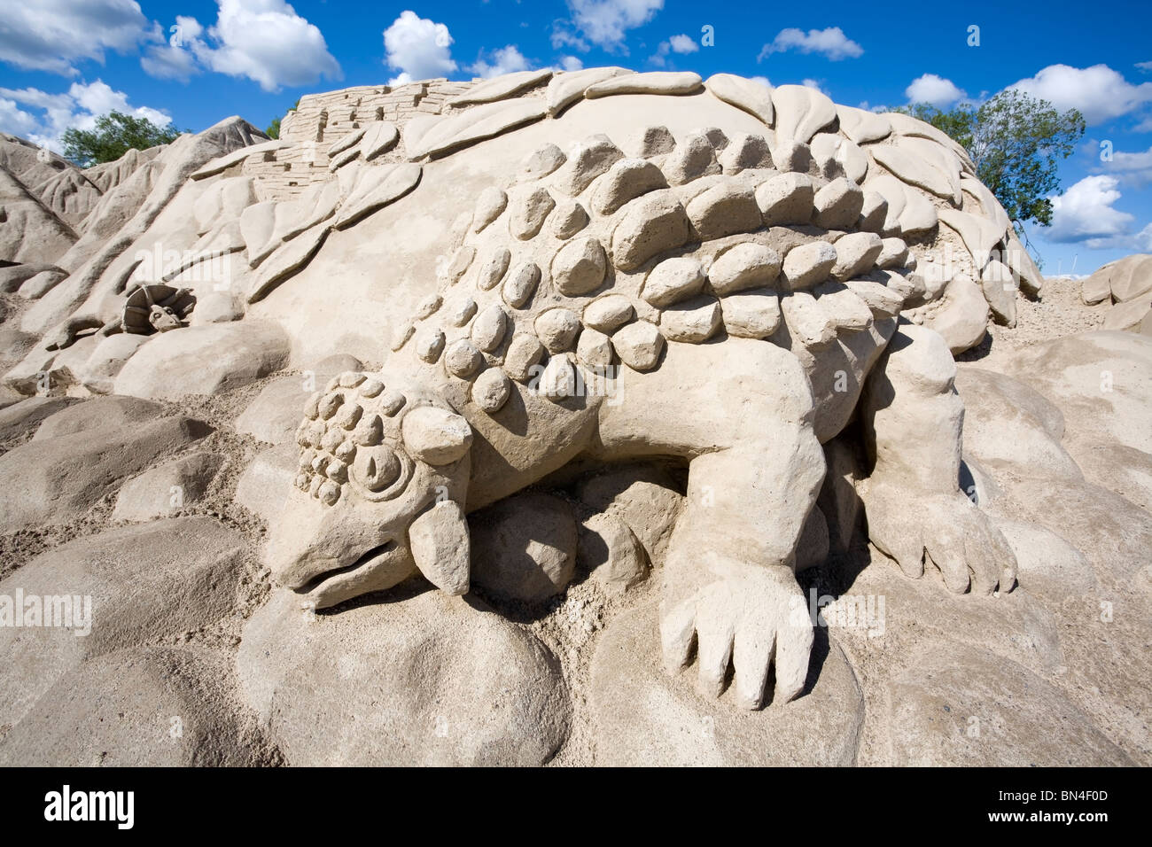 Dinosaur sand sculpture Stock Photo - Alamy