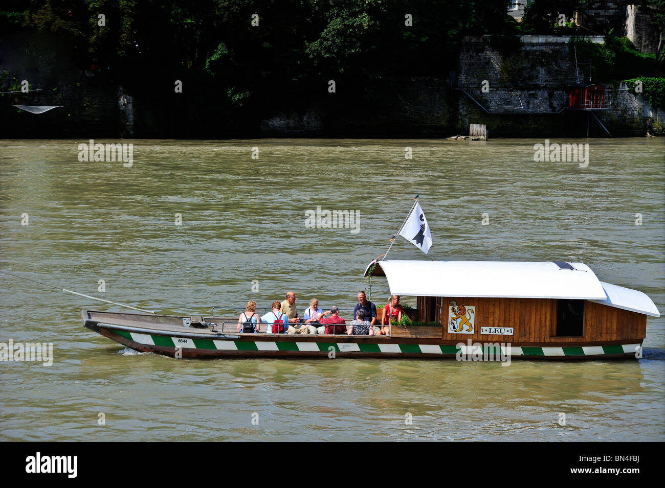 Cable ferry 'Leu' (Lion) carrying passengers across the river Rhine in Basel (Bale) Switzerland Stock Photo