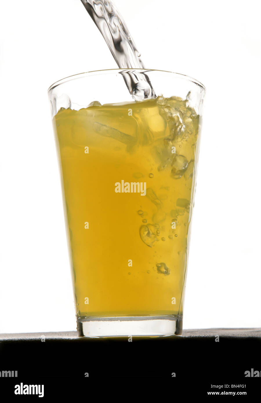 Orange squash drink with ice in studio Stock Photo Alamy