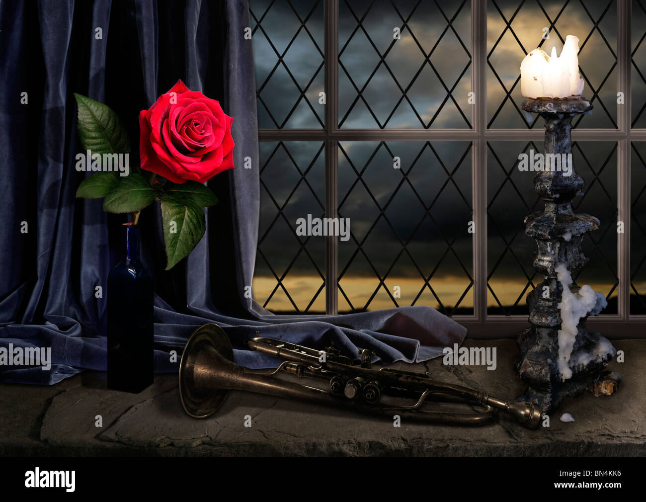 still life with rose candelabra and trumpet with sunset Stock Photo